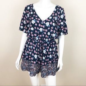 Trixxi Short Sleeve Romper Blue Floral Peep Hole Back